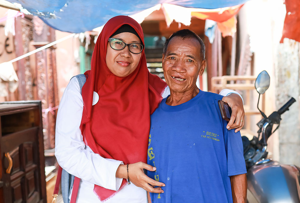 Endang smiling with an older Smile Train patient