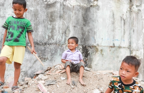 Ikhsan smiling and sitting after cleft surgery