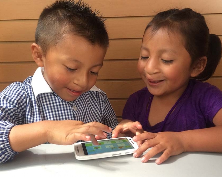 Cleft-affected children smiling and using Smile Train's speech therapy app